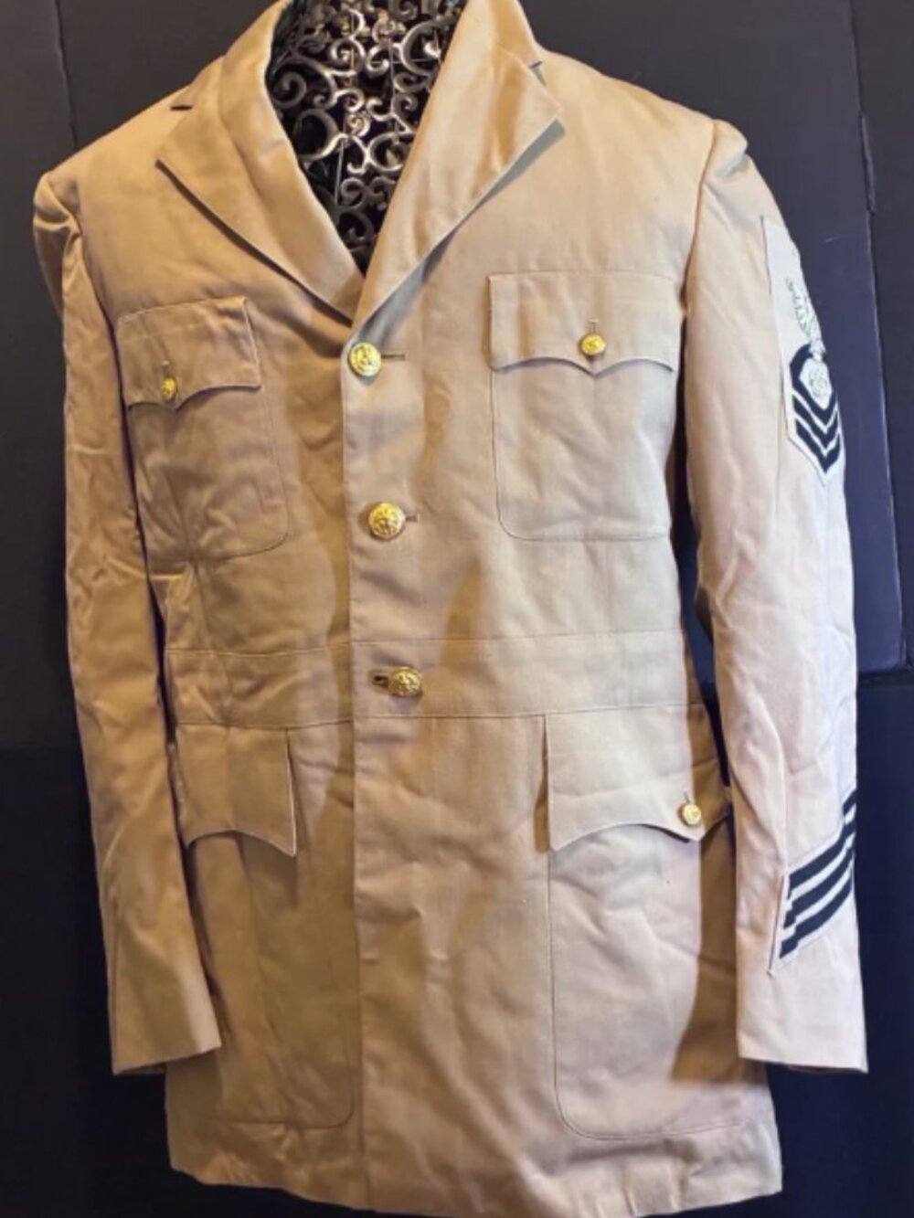 U.S. Navy Chief Petty Officer (CPO) Service Dress Khaki uniform jacket.